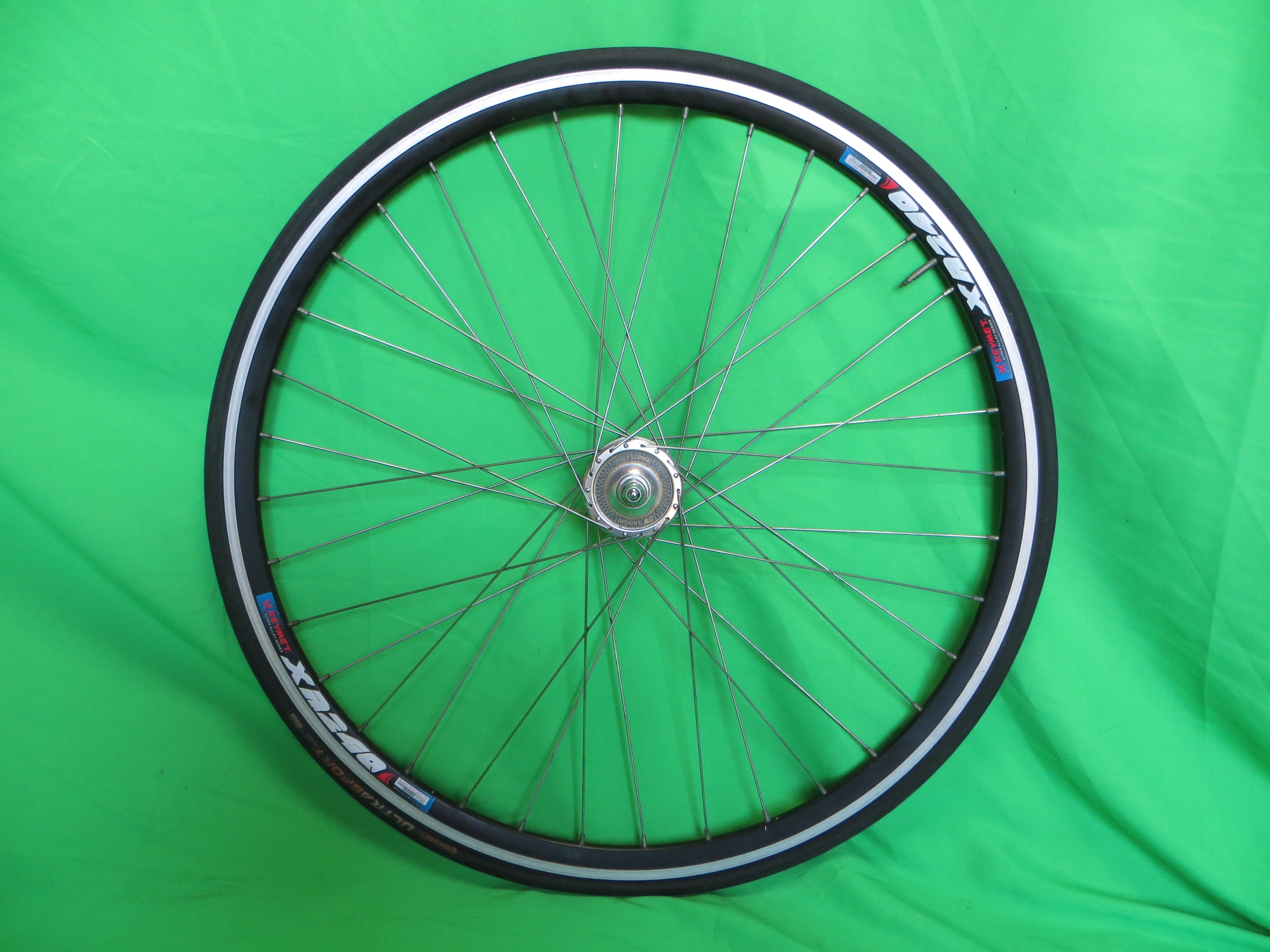 X Keyment XR240 36H 700c Clincher Rim, Sansin Professional 100mm/9mm Front NJS Hub, Continental Tire (24120101)